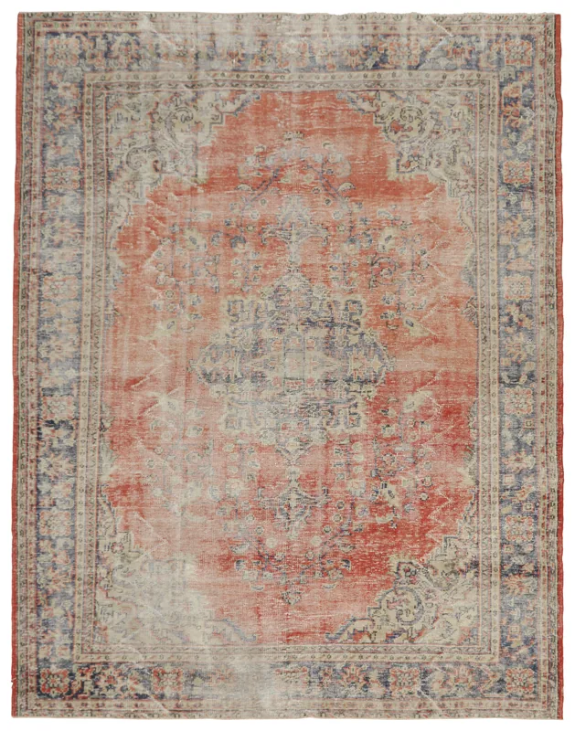 Full top view of the 8x11 vintage rust and navy medallion area rug on a white background.
