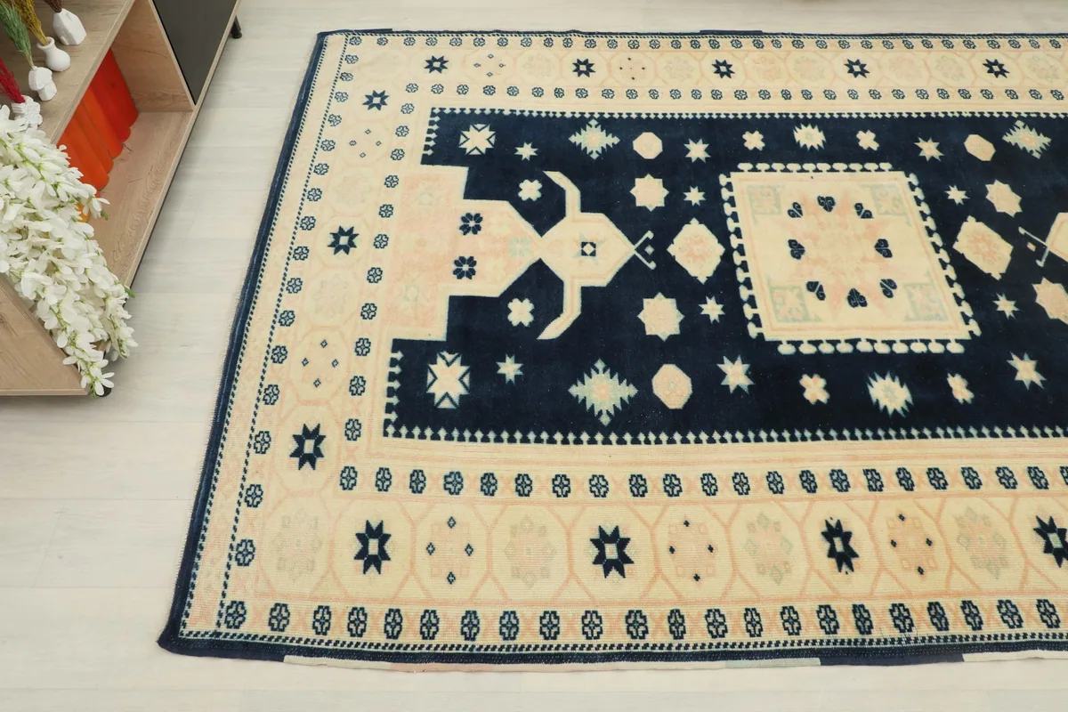 Corner view of the rug showing the intricate geometric patterns and colors