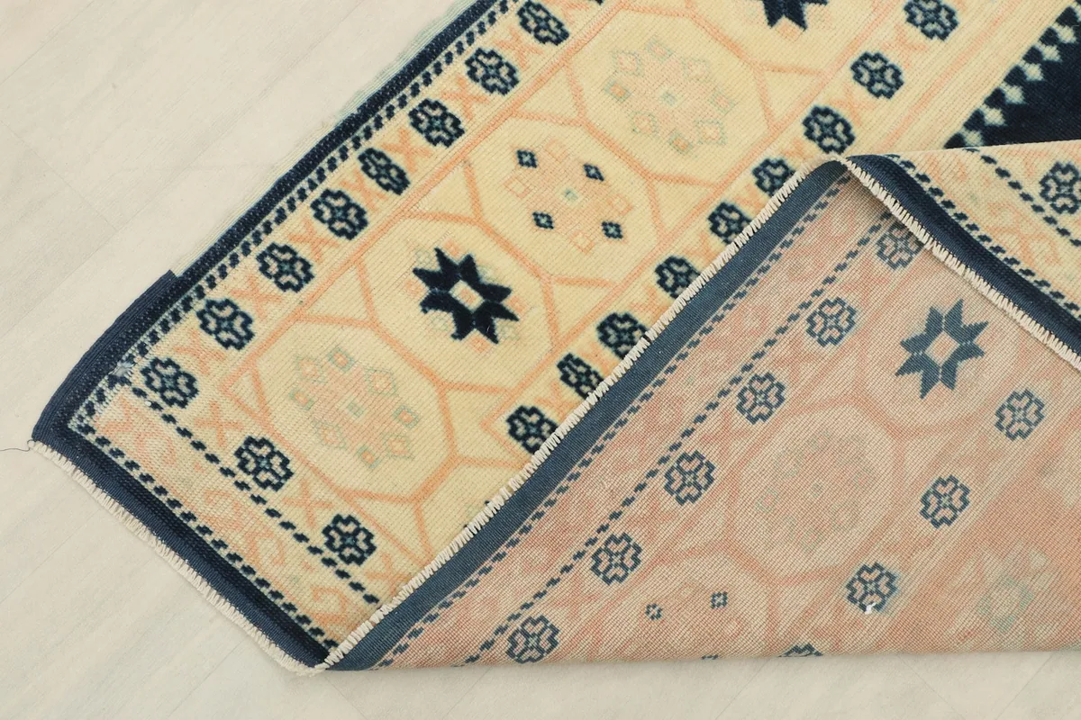 Underside view of the hand-knotted cotton foundation and wool pile