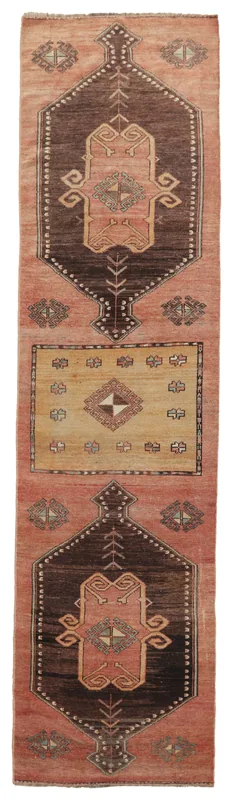Full top view of the rust, brown, and tan geometric Anatolian runner rug on a white background.