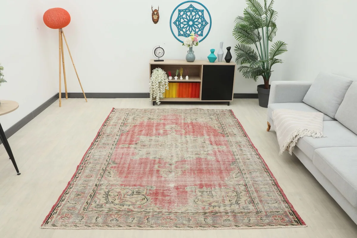 Overhead view of the vintage rose and beige rug in a contemporary living room