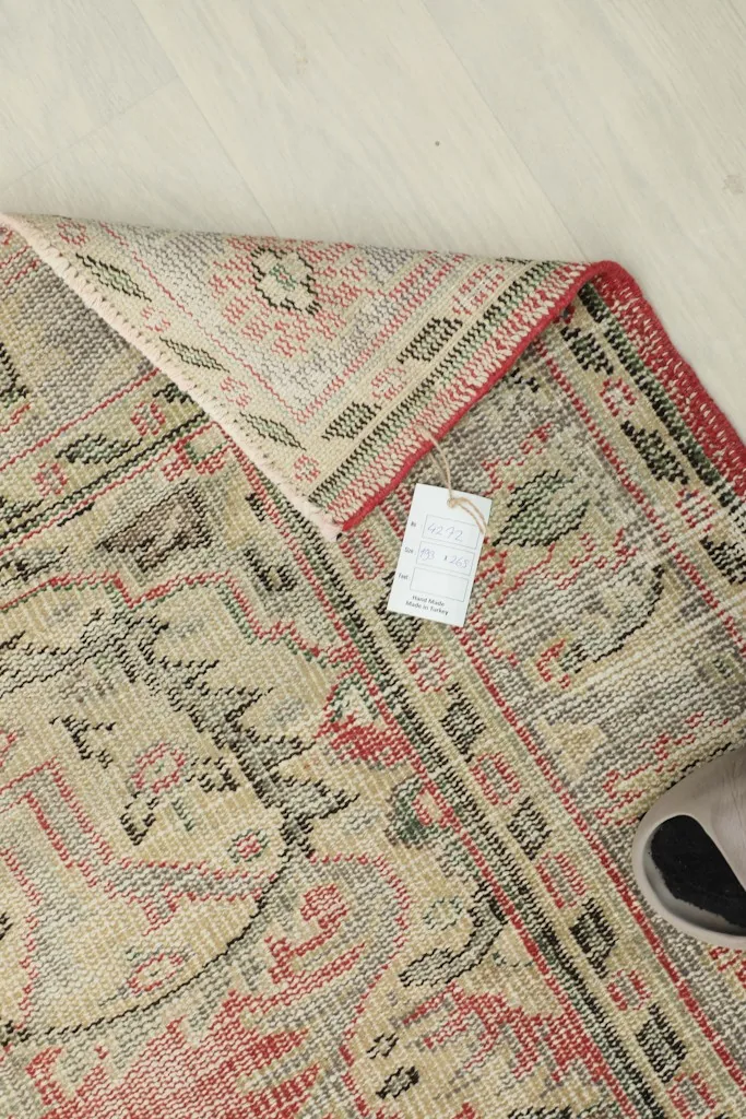 Close-up of the low pile texture and intricate knotting from a folded section