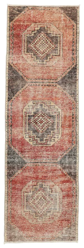 Full top view of the vintage Anatolian runner rug with rust, charcoal, and beige geometric patterns.