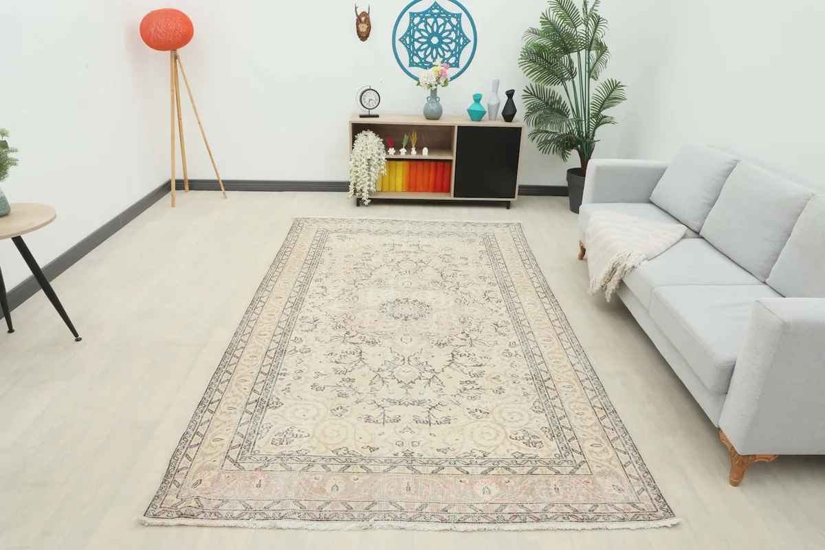 Full room view of the beige vintage Anatolian rug, showcasing its size and presence in the space.