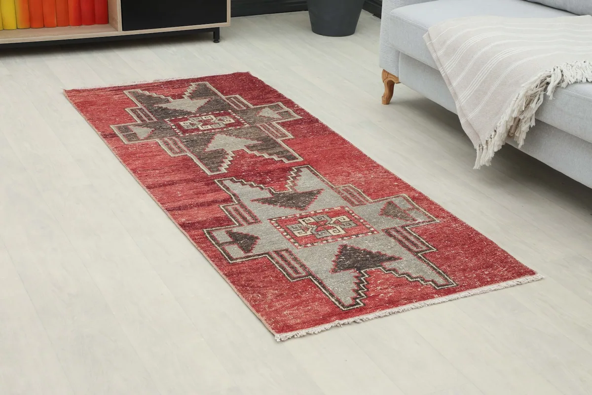Angle view of the red and gray tribal runner placed in a modern living space.