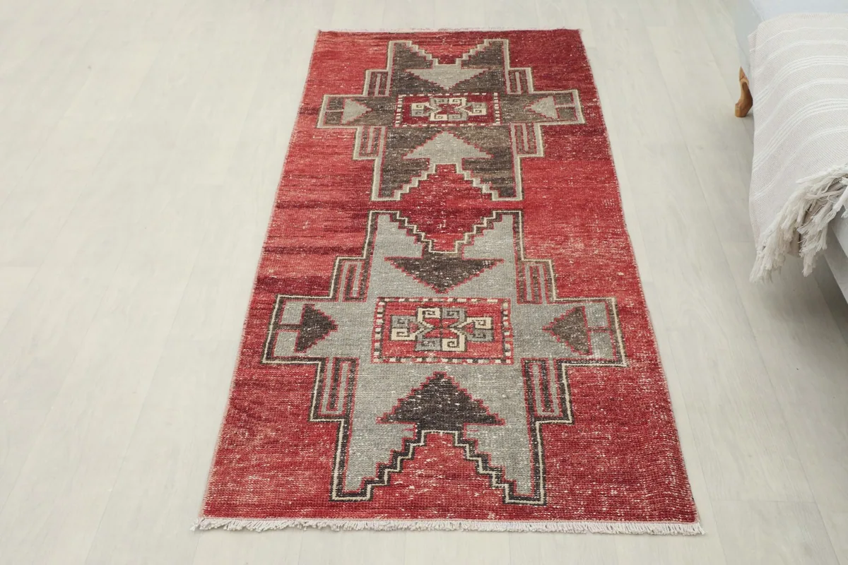 Overhead shot of the entire red geometric runner, highlighting its placement in a room.