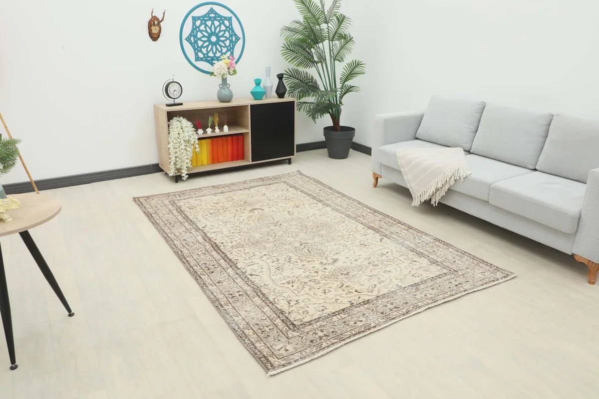 Area rug displayed in a modern living room setting with a gray sofa
