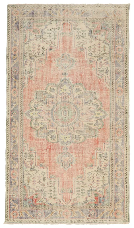 Full top view of a rust and blue vintage Anatolian area rug with a central medallion