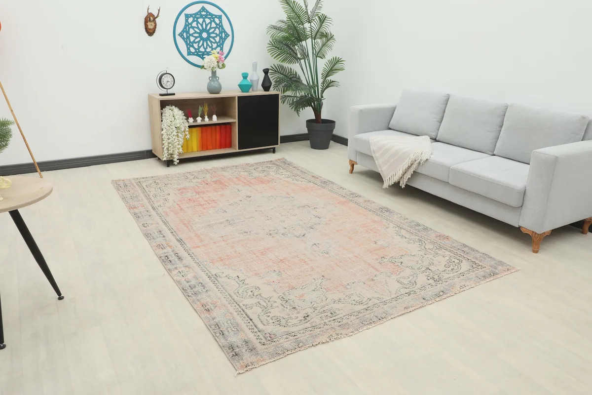 Vintage rose and gray Anatolian rug in a contemporary living room setting