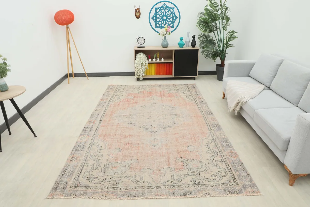 Full room view of the rose and gray Anatolian rug as a centerpiece in a spacious interior