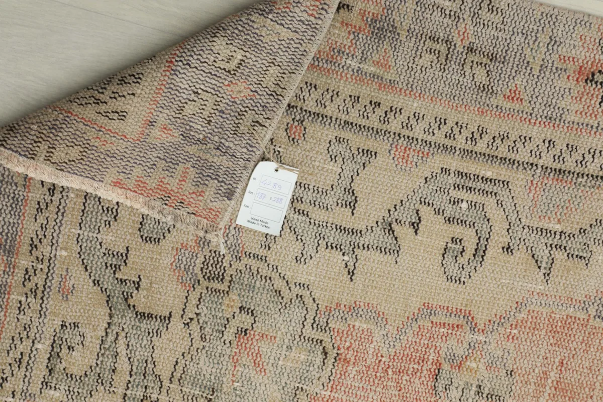 Underside of the hand-knotted rug, displaying the cotton foundation and intricate knotting
