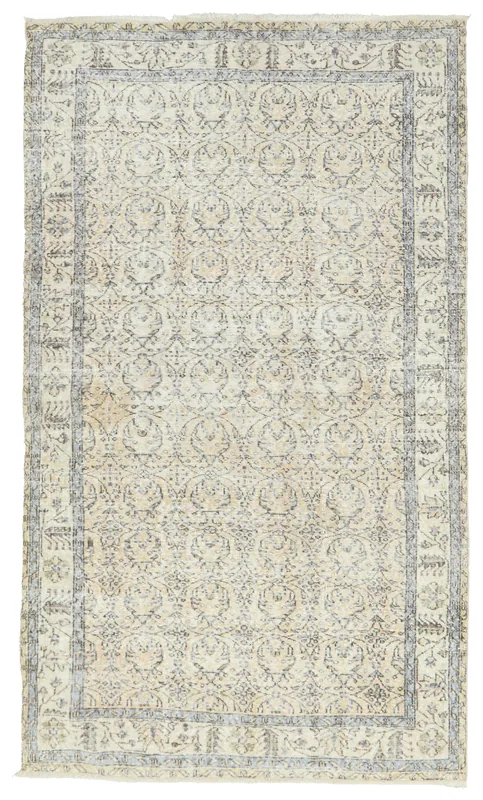 Full top view of the 5x9 ivory and charcoal vintage Anatolian area rug on a white background.