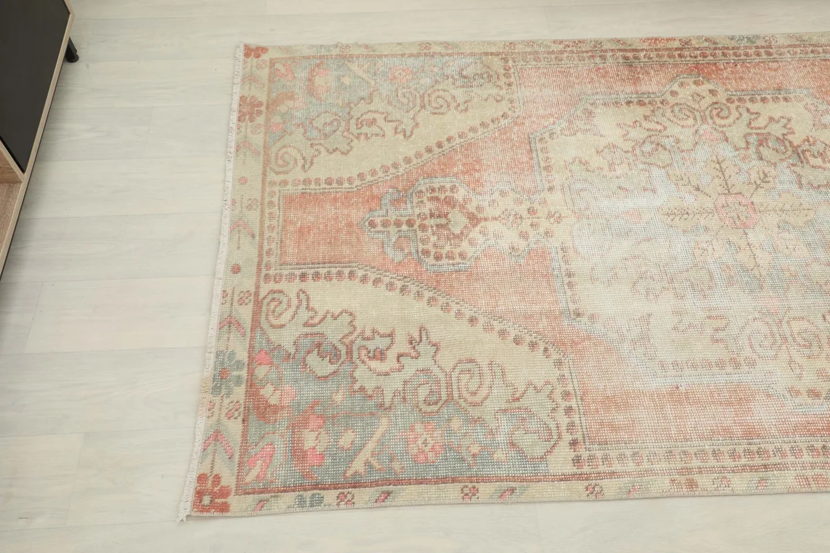 Detailed angle view of the rug's tribal motifs and color variations