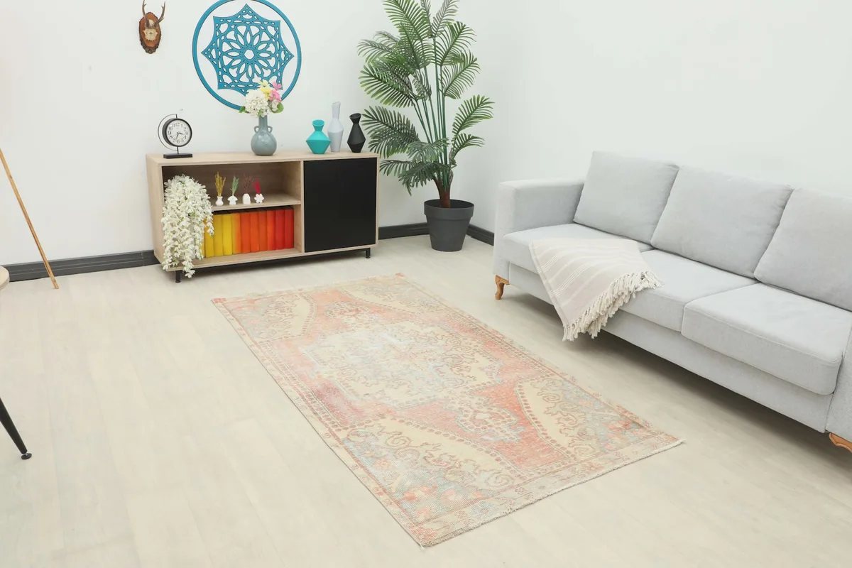 Vintage Anatolian rug displayed in a bright modern living room setting