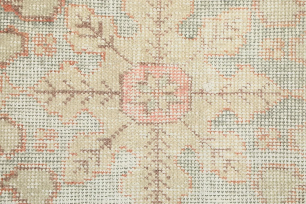 Macro view of the hand-knotted wool pile and cotton foundation