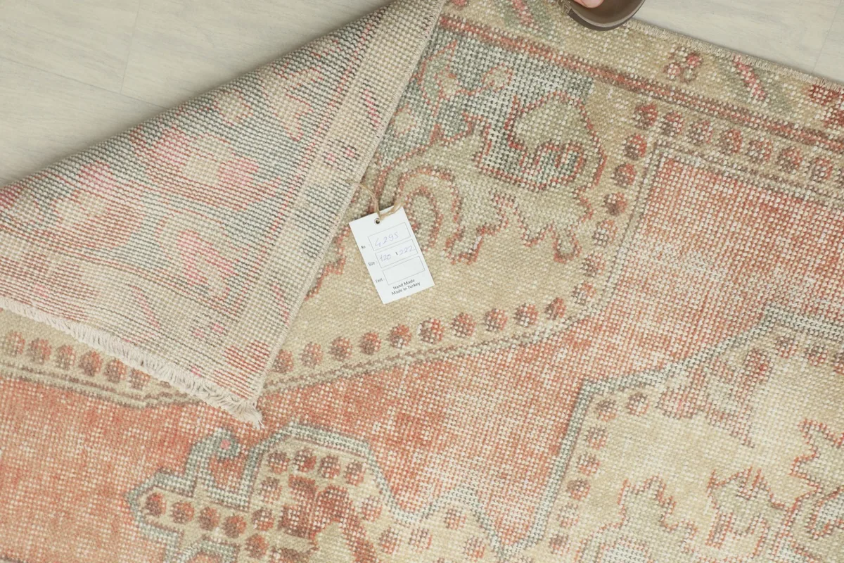 Back of the rug showing the label and hand-knotted structure