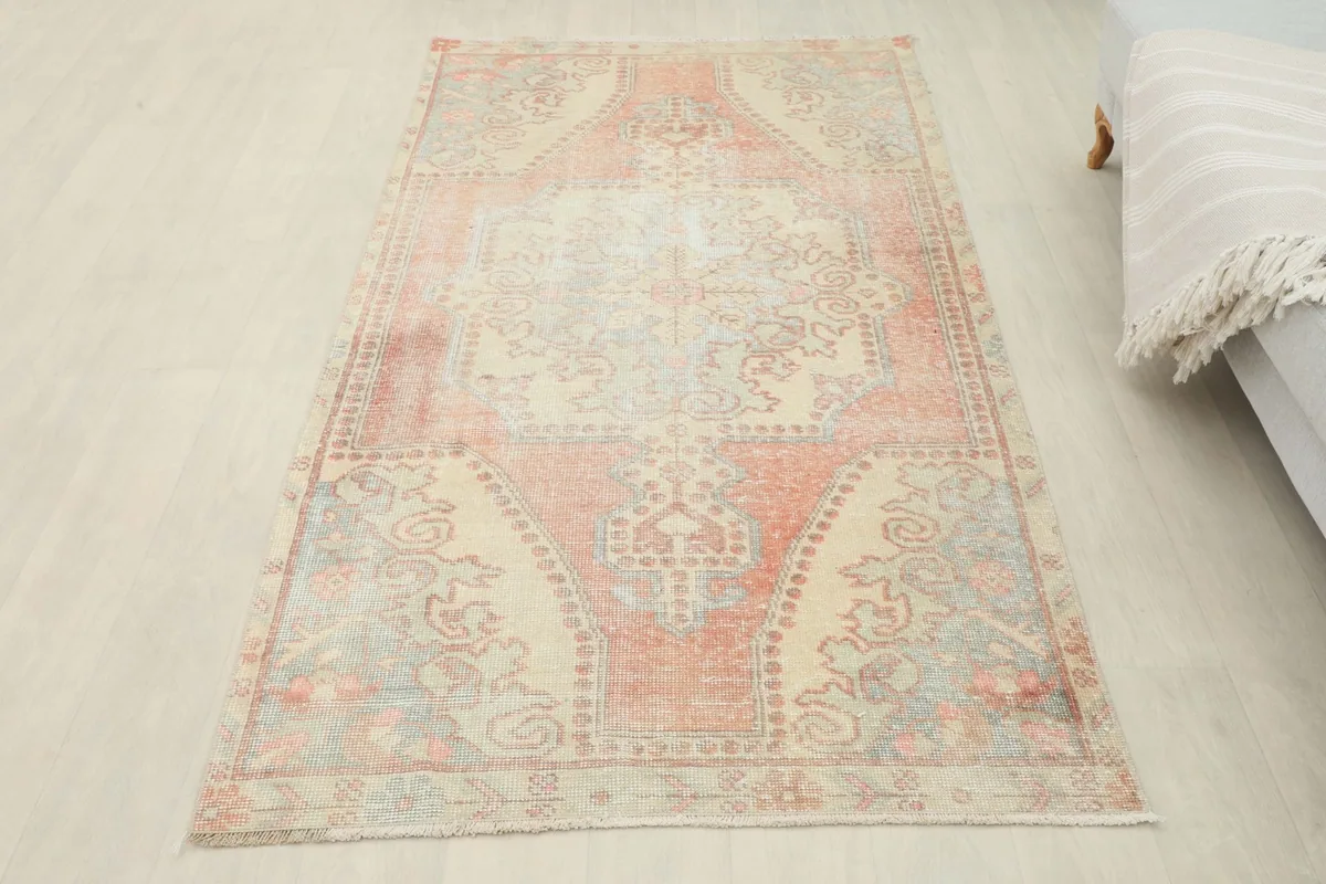 Full overhead view of the vintage Anatolian rug from a slight angle