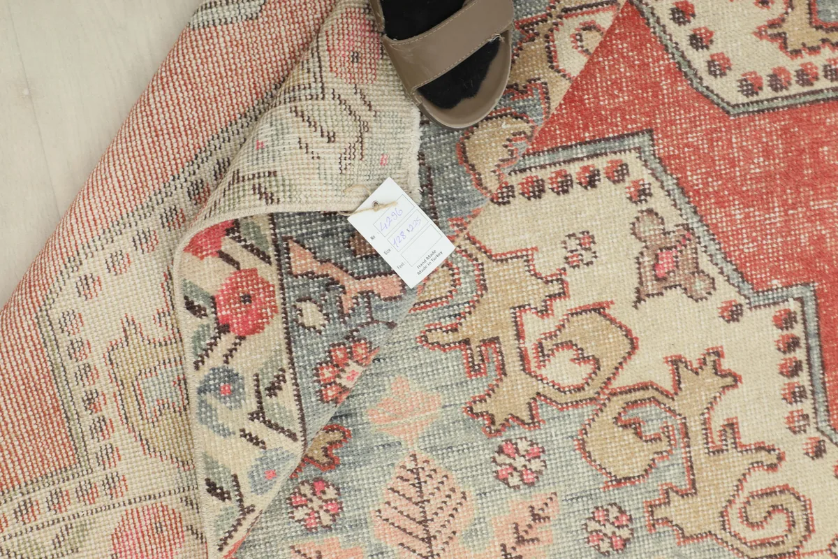 Rust Ivory Medallion Anatolian Rug showing the back of the rug and its hand-knotted construction