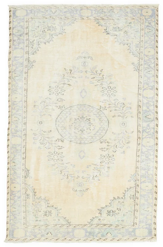 Full overhead view of the hand-knotted ivory and blue vintage Anatolian rug