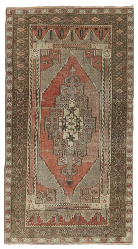 Full top view of the 3'5" x 6'6" rust and gray geometric medallion vintage Anatolian area rug