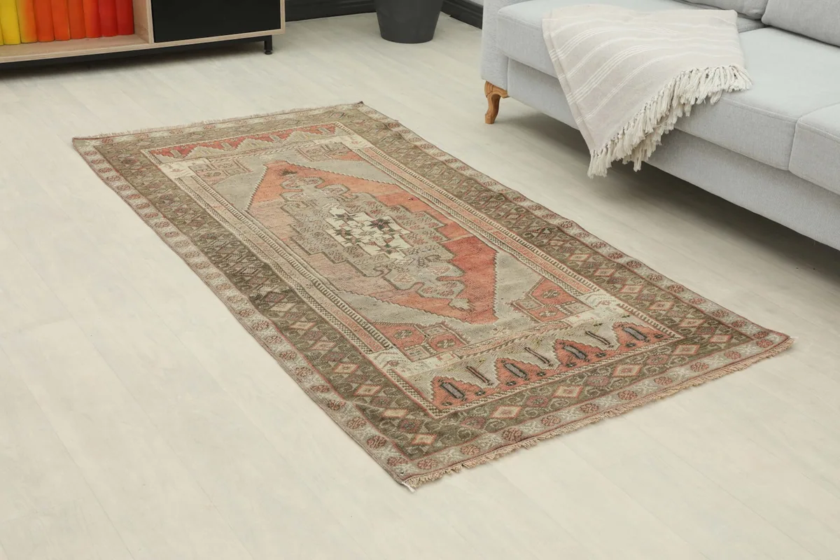 Angle view of the rust geometric medallion rug in a room, highlighting its size and placement