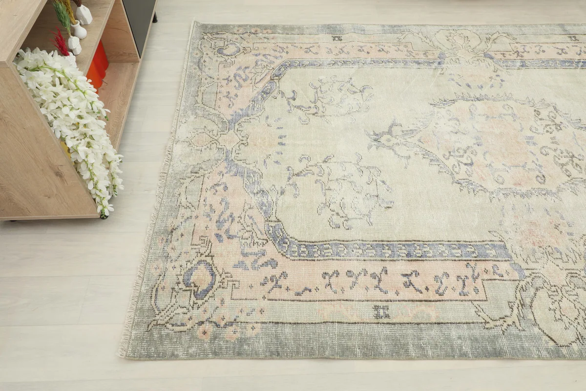 Another angle of the Faded Gray Rose Medallion Rug, highlighting the faded rose and gray tones.