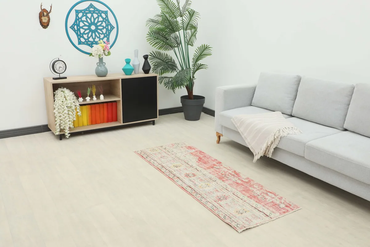 Runner rug placed in a living room setting, showcasing its size and colors in context with furniture