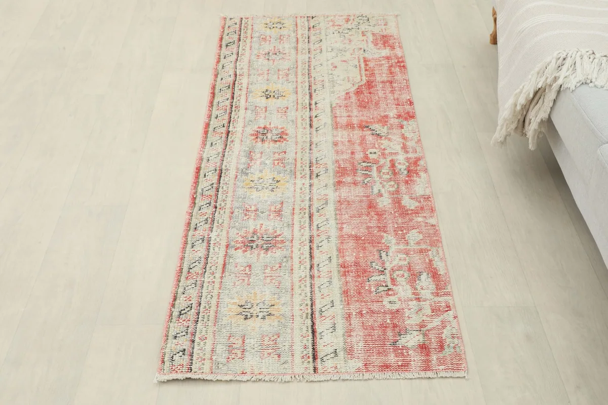 Full overhead view of the runner rug, displaying its entire length and design on a light floor
