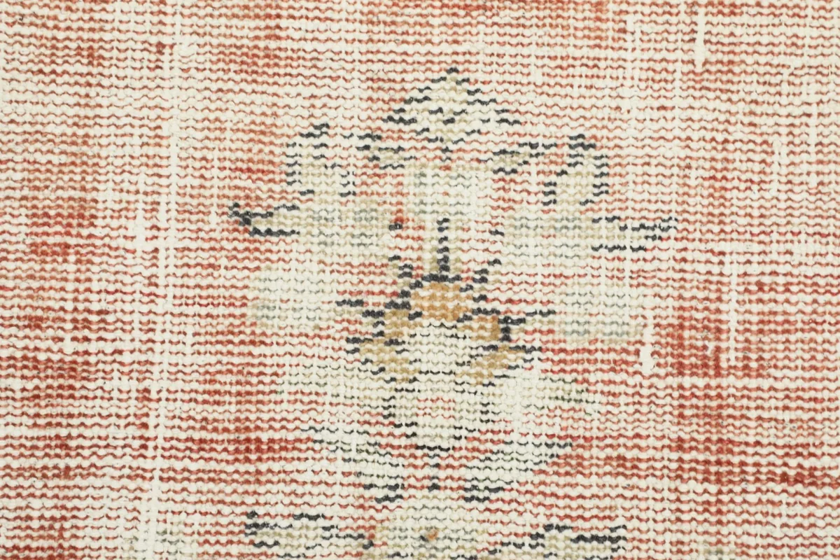 Close-up of the low wool pile and faded rose color with subtle patterns
