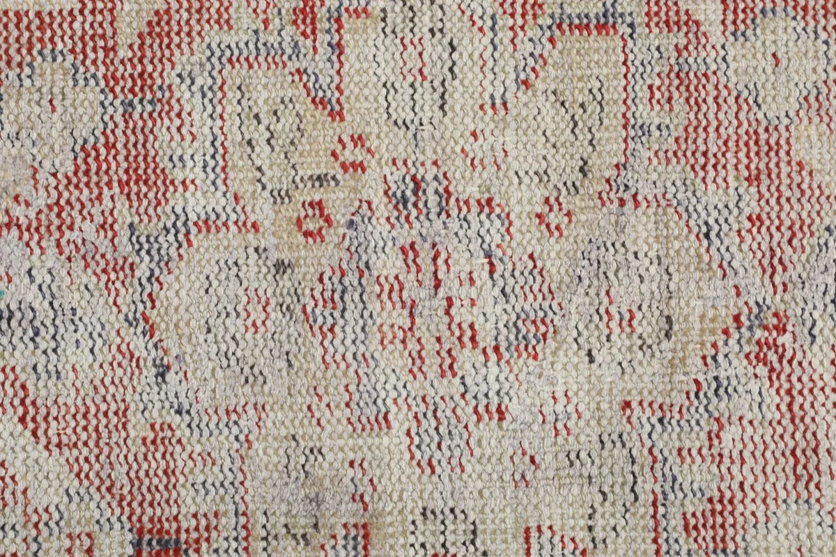 Detailed view of the low wool pile and hand-knotted texture of the rug