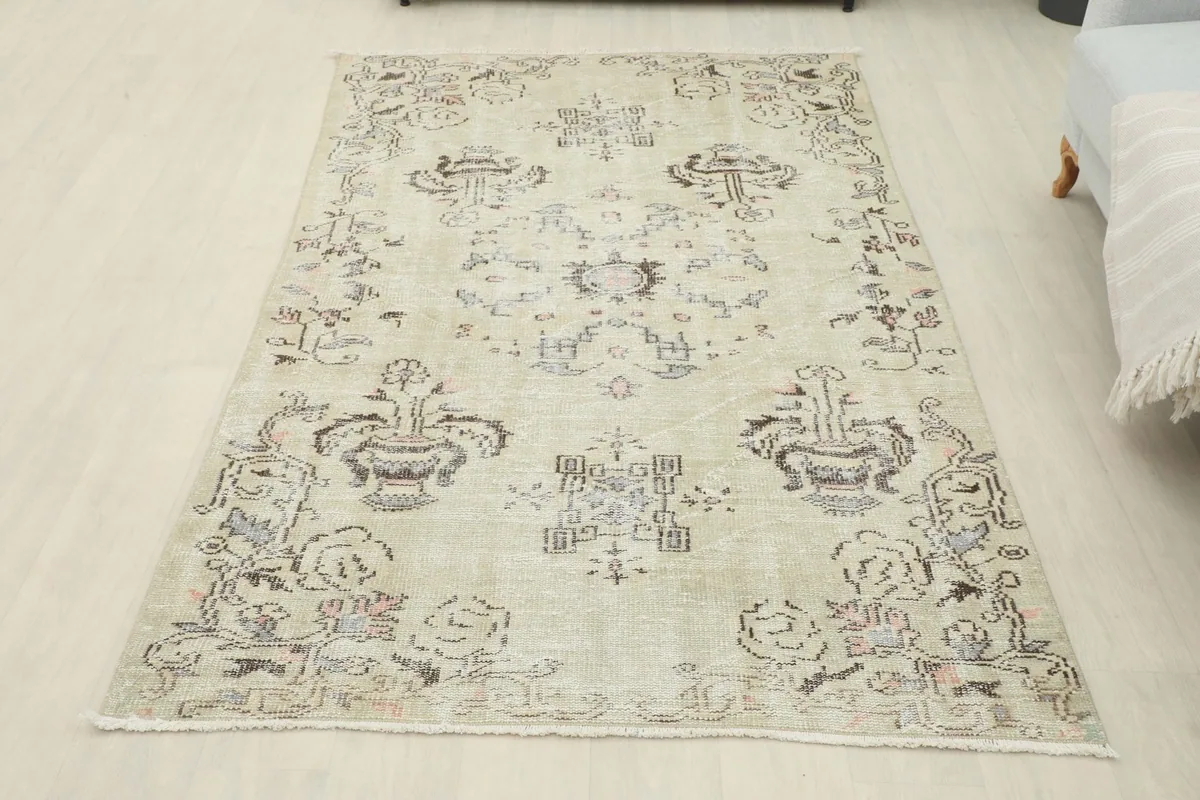 Full overhead view of the beige rug, showing its rectangular shape and design in a room setting