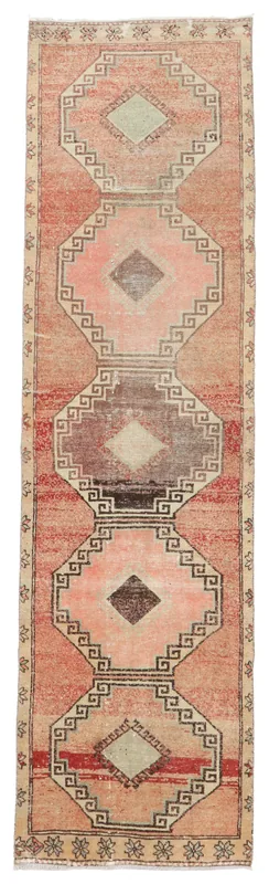 Full overhead view of the Muted Rust Geometric Runner on a white background