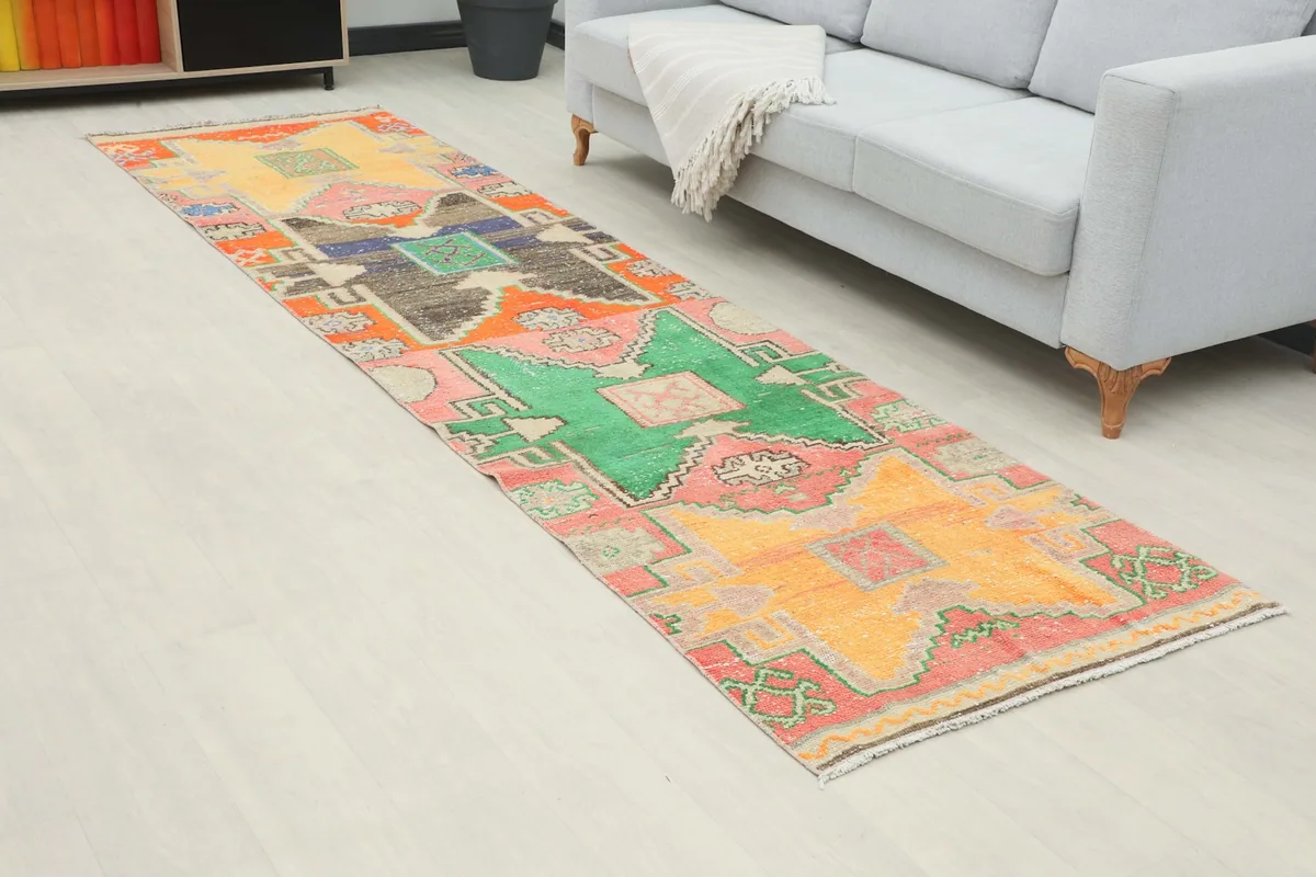 Angled view of the multicolor geometric runner rug extending into a room
