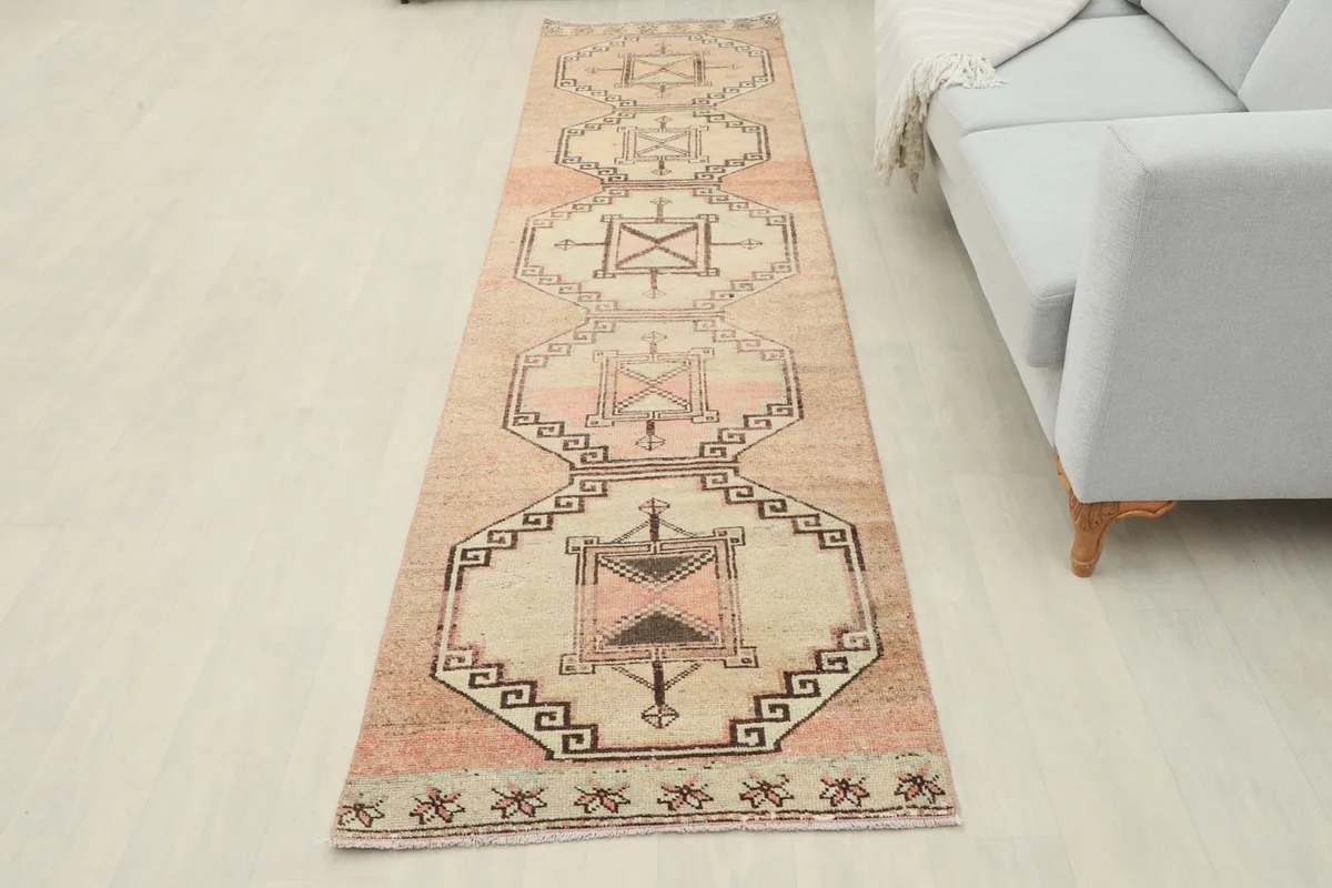 Full overhead view of the runner rug in a room setting, showing its placement relative to a sofa
