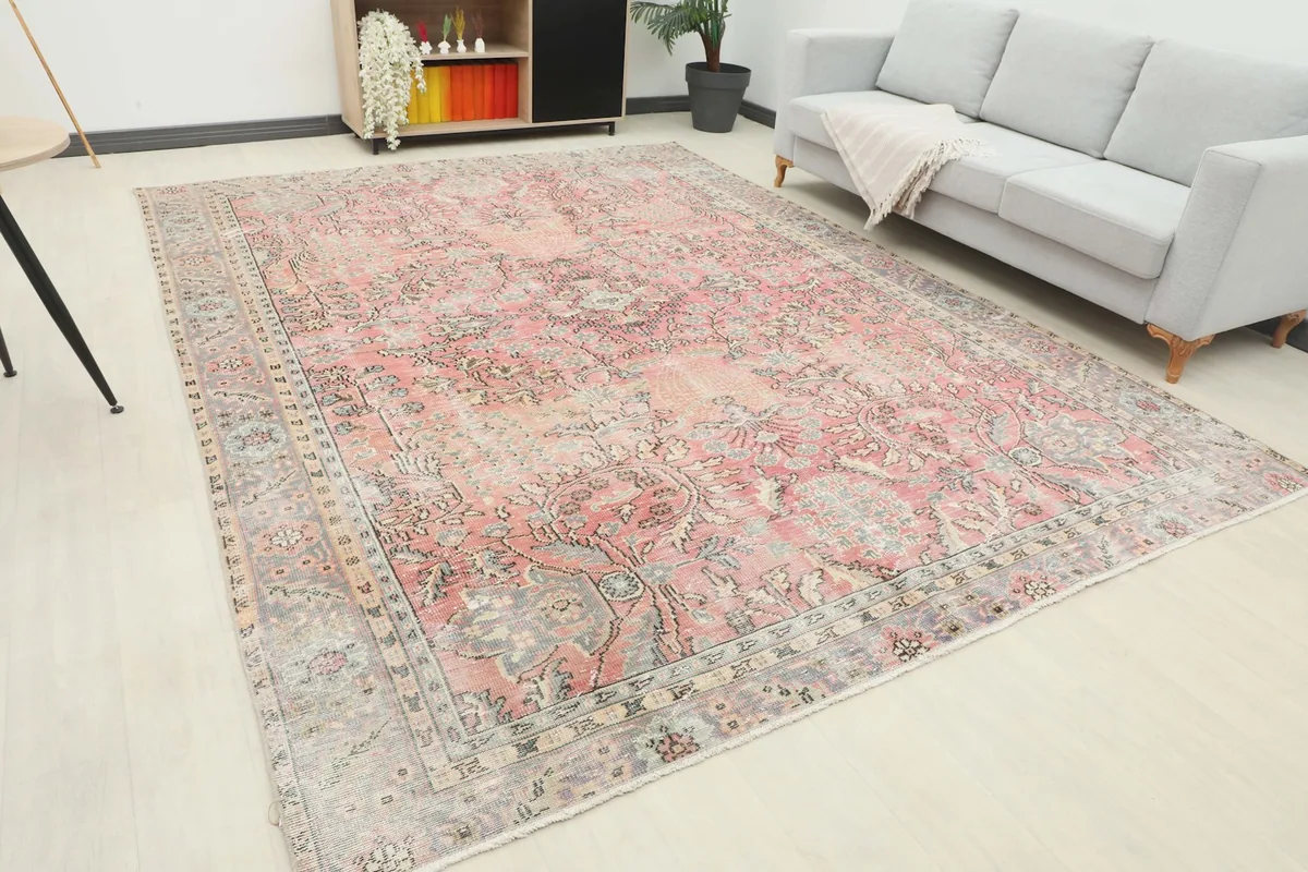 Angle view of the rose vintage Anatolian rug showing its placement in a modern living space