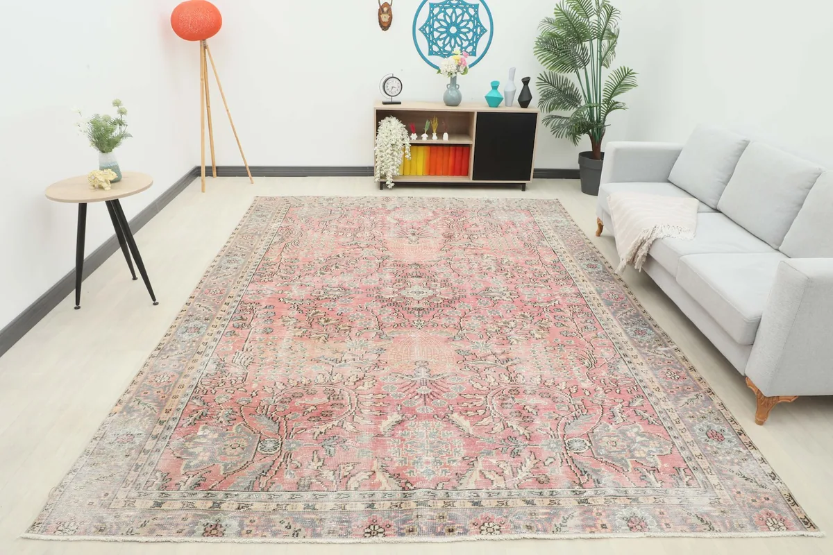 Full room view of the large rose and gray vintage Anatolian rug, showcasing its scale and presence