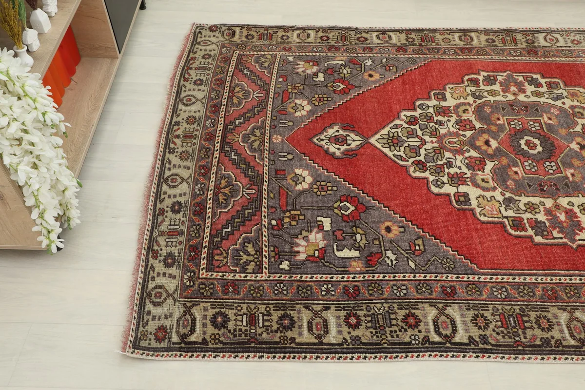 Another corner angle shot of the rug, revealing the intricate geometric motifs and color variations.