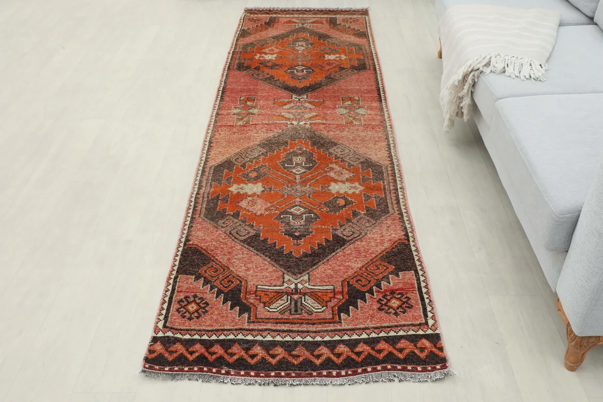 Full room view of the Rose Orange Geometric Anatolian Runner laid out, showcasing its overall appearance.
