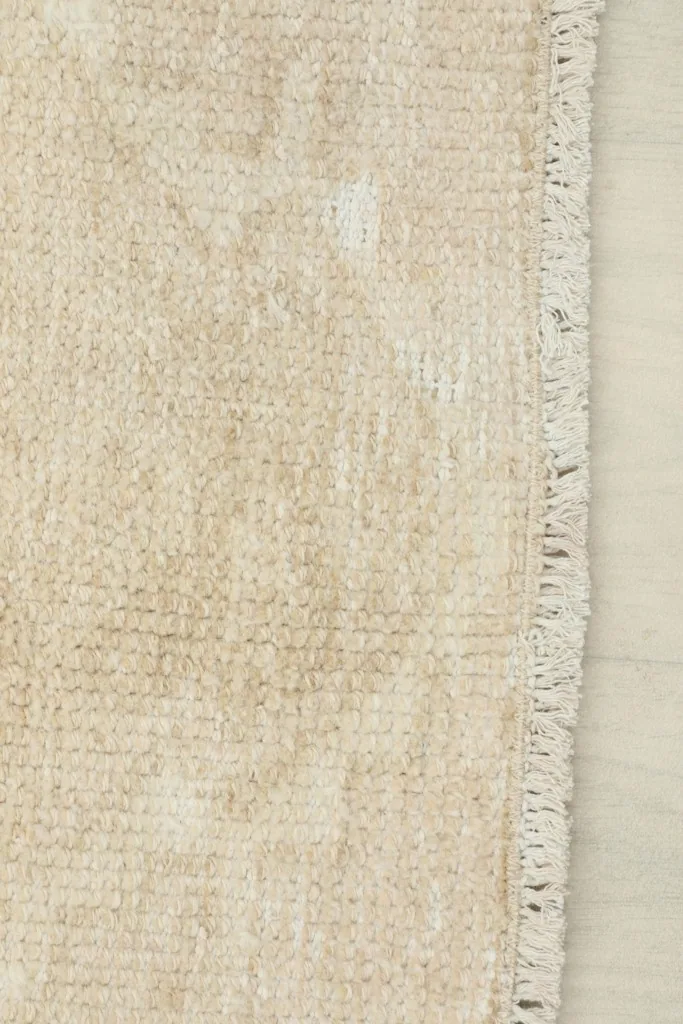 Close-up showing the low wool pile and texture of the vintage runner rug
