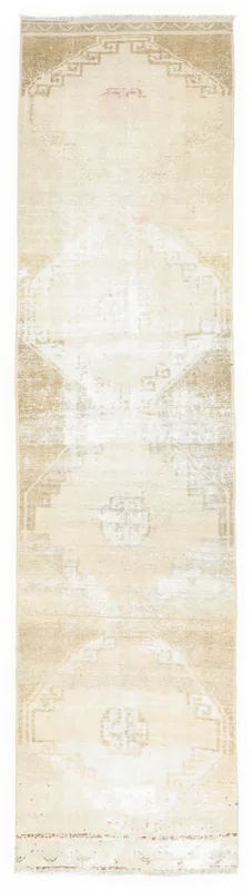 Full top view of the beige geometric Anatolian runner on a white background