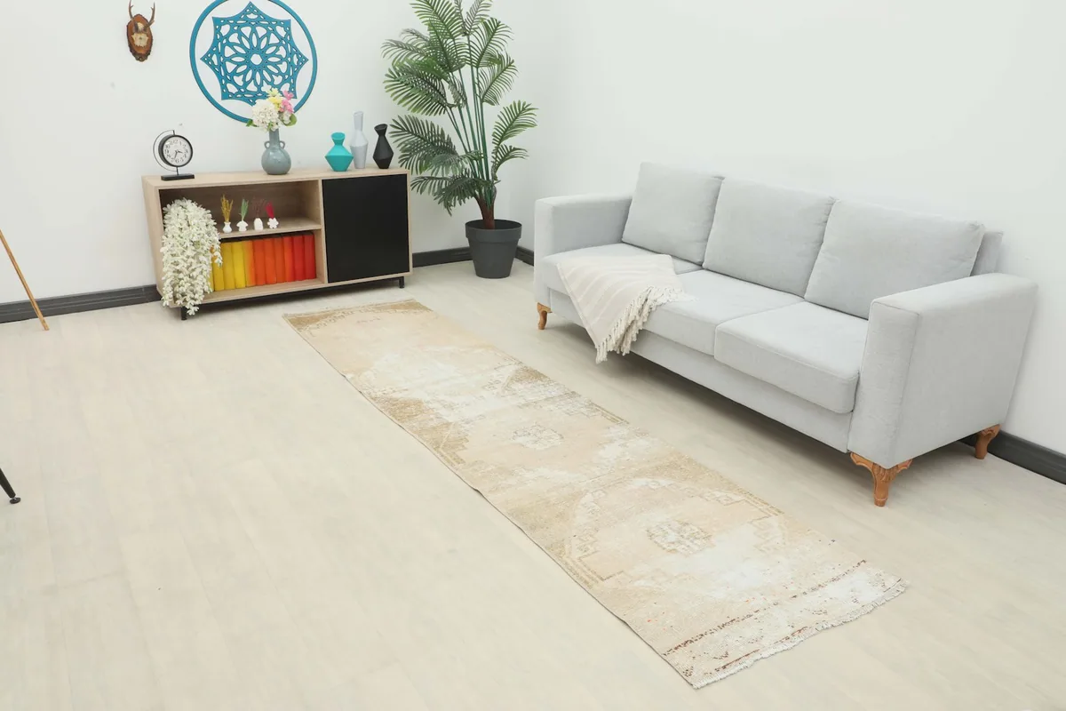 Runner placed in a modern living room setting next to a couch