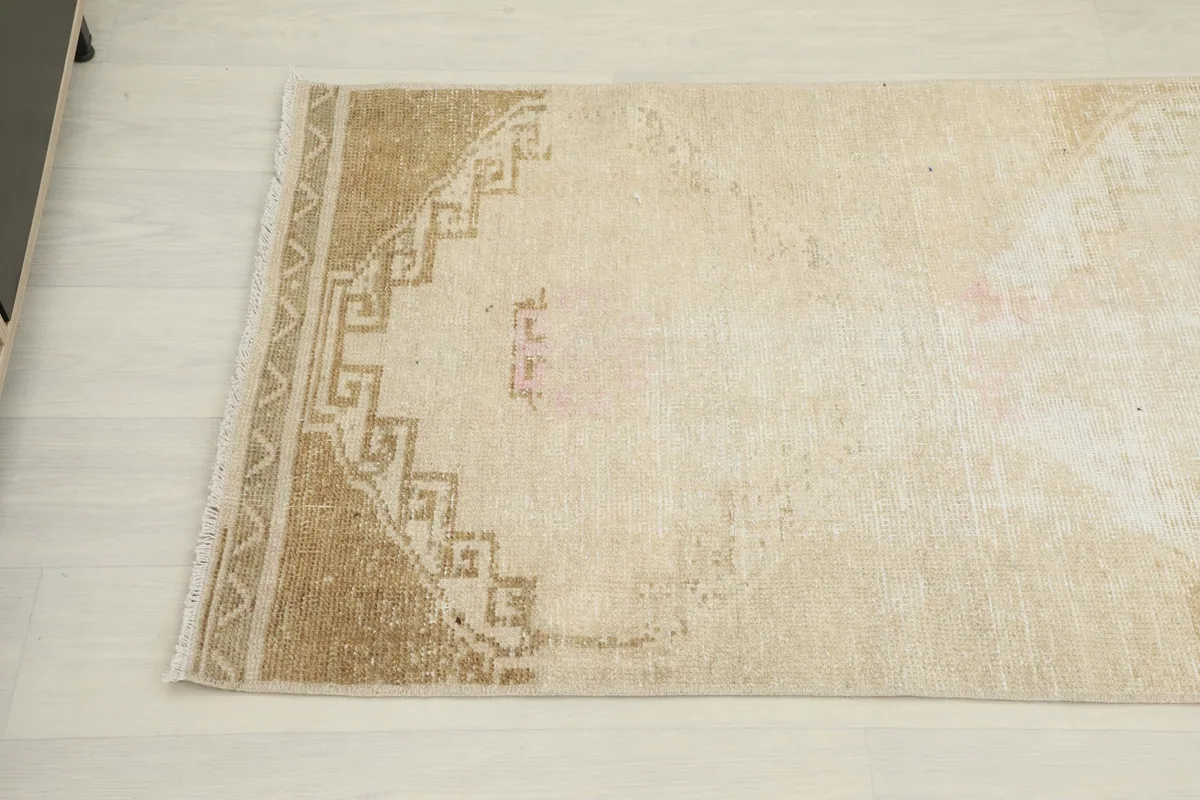 Close-up of the other end, highlighting the subtle border and central medallion motif
