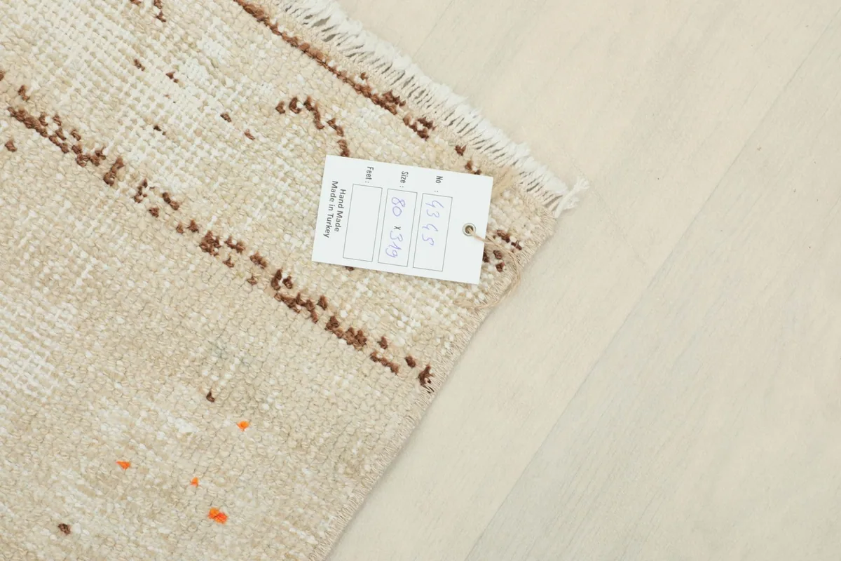 Close-up of the rug's back with the product tag showing dimensions