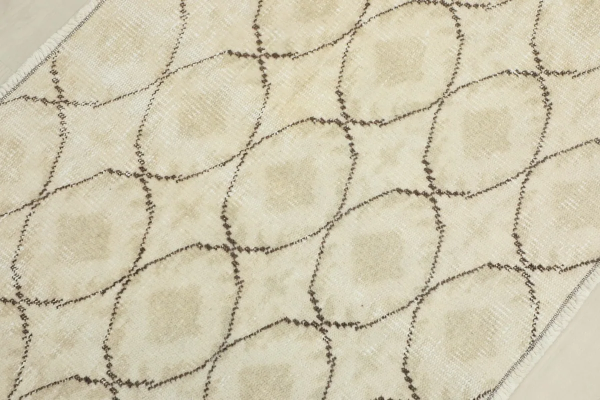 Close-up showing the low pile texture and subtle color variations of the rug