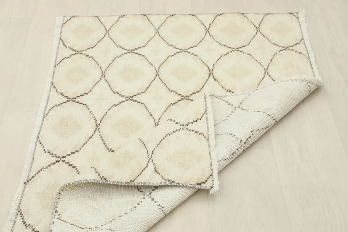 Backside view of the hand-knotted rug showing the foundation and construction