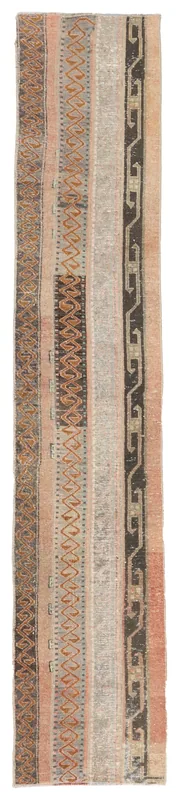 Full overhead view of the 1'9" x 10'3" vintage Anatolian runner on a white background
