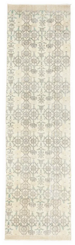 Full top view of the 2'7" x 9'8" vintage ivory geometric tribal runner rug on a white background.