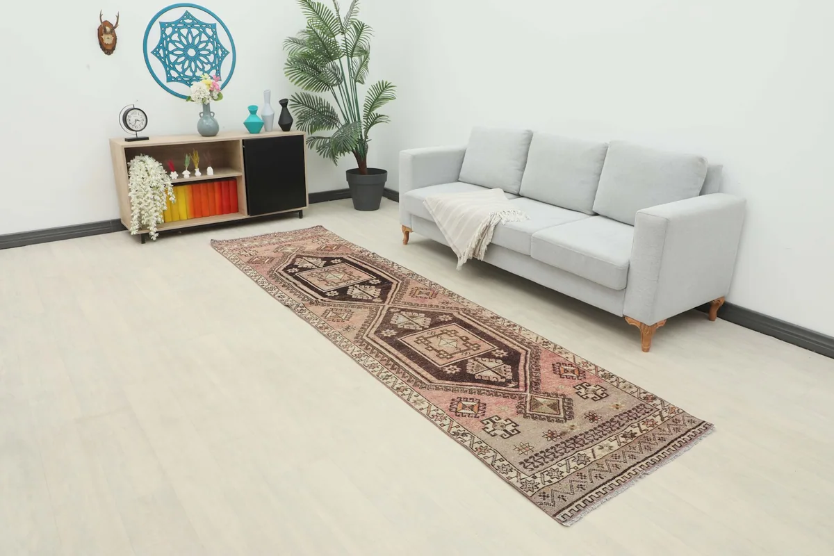 Vintage runner rug in a room setting next to a sofa