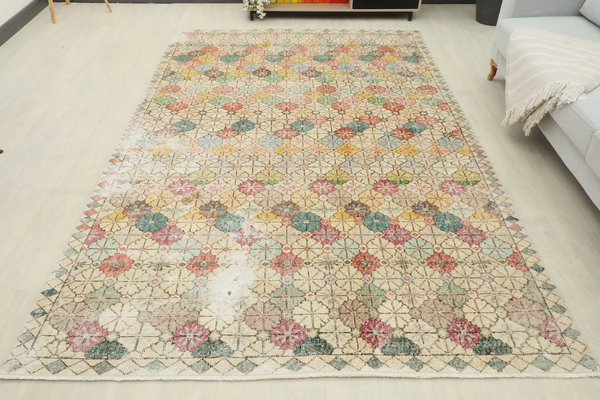 Full overhead view of the vintage area rug laid out in a room, showing its complete design and dimensions.