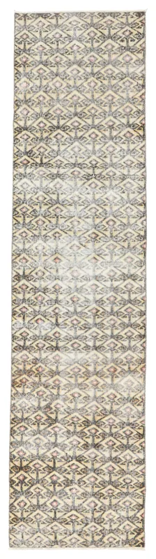 Full overhead view of the beige, charcoal, and rose geometric tribal runner rug